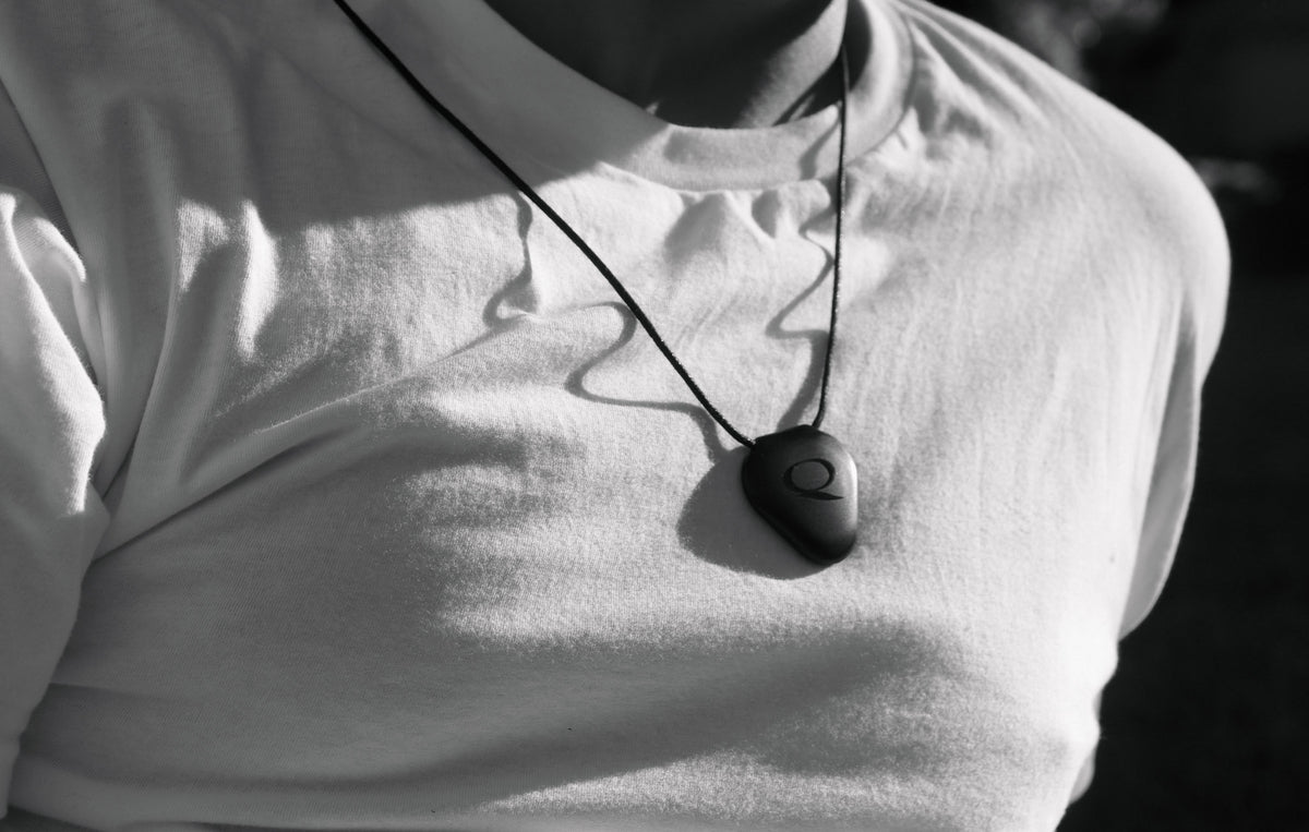 Q-Link pendant worn by a longtime community member