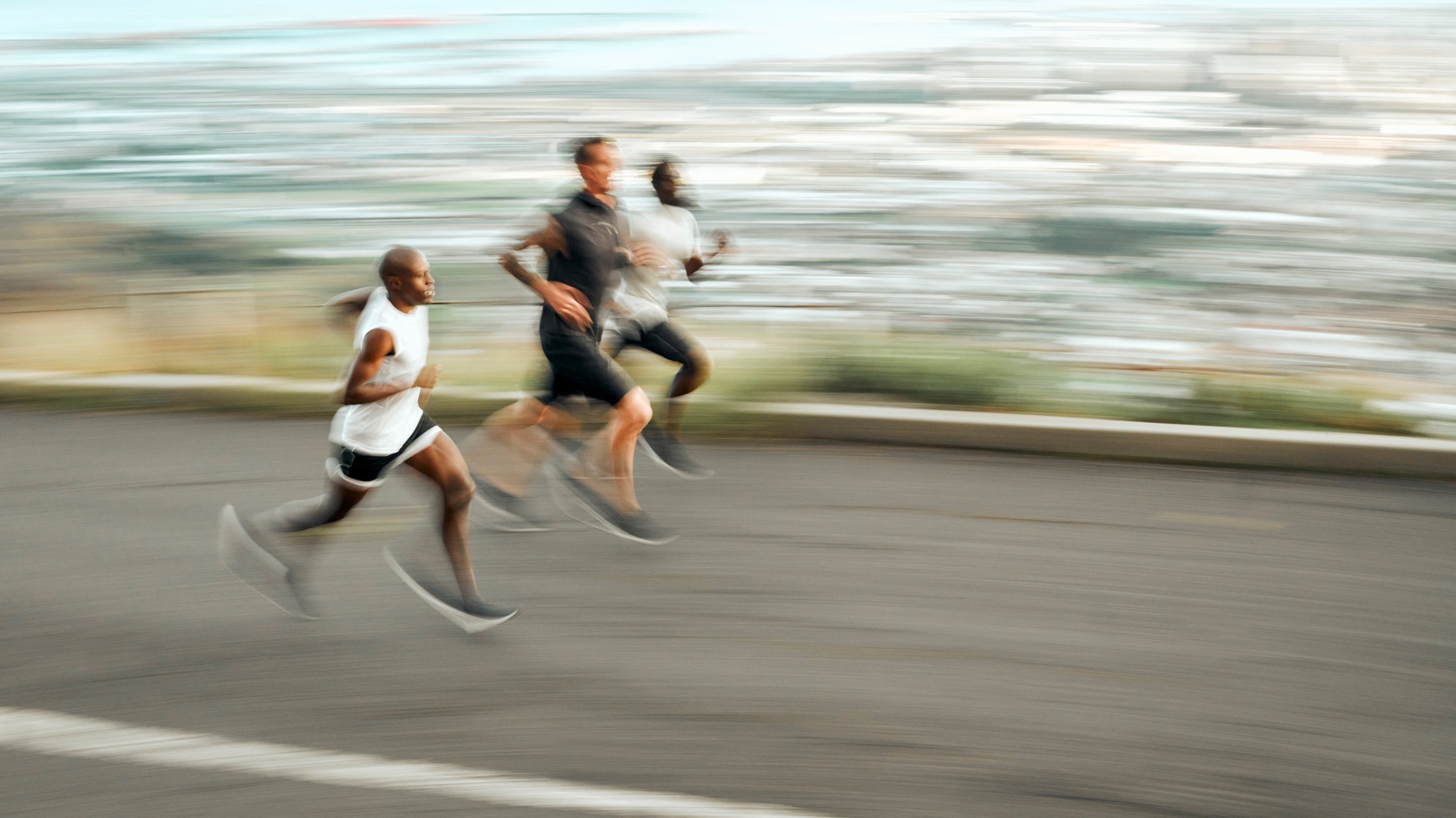 People running outdoors representing Q-Link benefits for active modern life
