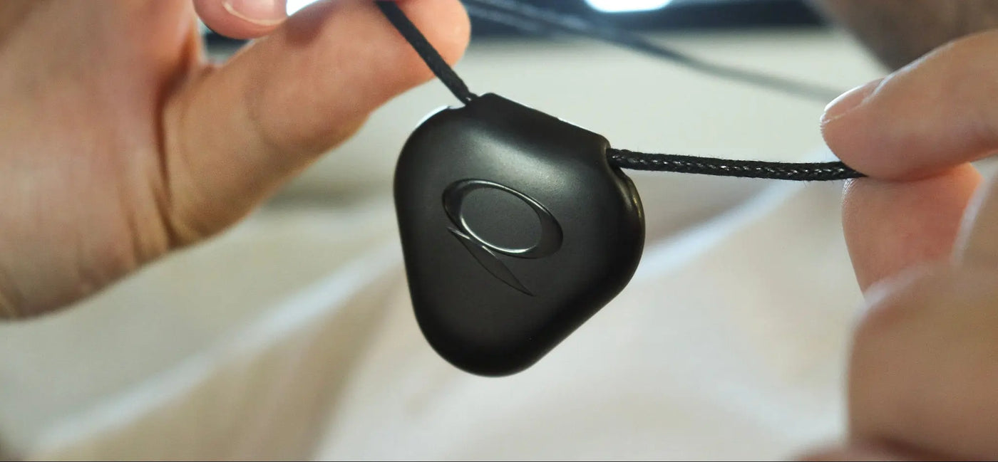 Close-up of a black Q-Link pendant for the Q-Link blog section